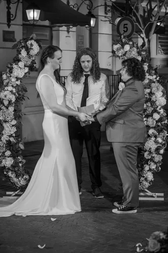 A black and white photo of Alexis, Christian, and Ryan